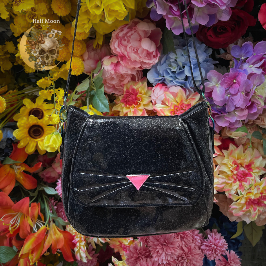 The Purrrrfect crossbody. The cat bag. In black sparkle faux patent leather